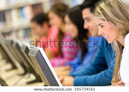 Group of students at the library using computers