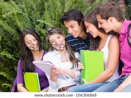 Group of friends studying together and smiling