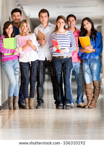Group of students looking happy at the university hallway
