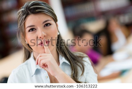 Female student asking for silence in the library
