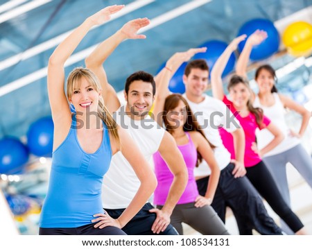 Gym people stretching and looking very happy