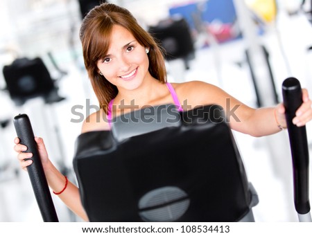 Beautiful woman at the gym looking happy