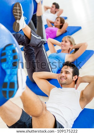 Group of people at the gym in a Pilates class