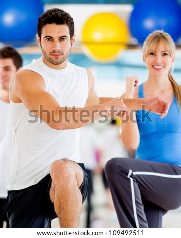 Group of people in an aerobics class at the gym