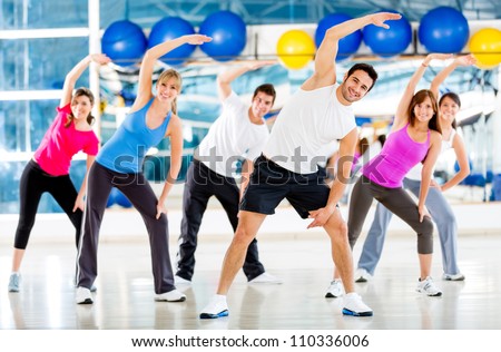 Group of people at the gym in an aerobics class