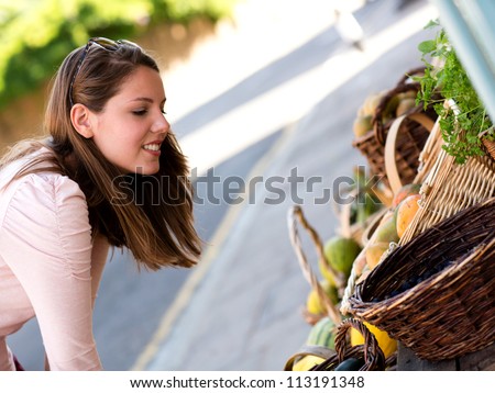 Woman grocery shopping at a local shop