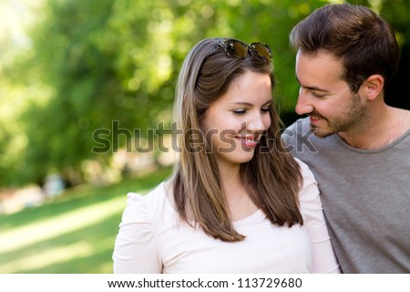 Portrait of an affectionate couple flirting outdoors