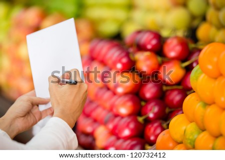 Close up of a shopping list at the grocery store