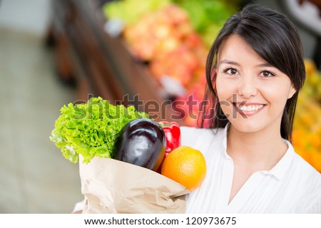Latin woman shopping for groceries at the marketplace