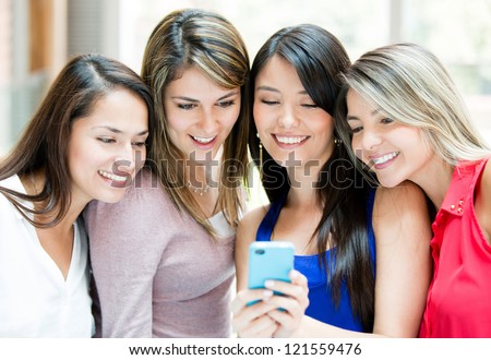Group Of Girls Looking At A Cell Phone