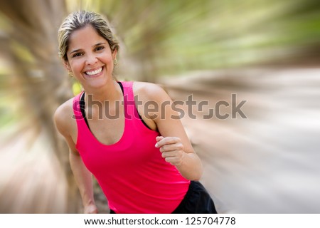 Fit female runner working out and looking very happy