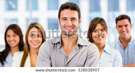 Group of business people at the office looking happy