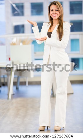 Welcoming business woman looking happy at the office