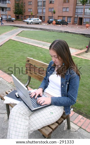 casual woman on laptop outdoors
