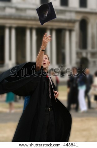 graduating student throwing the hat on the air