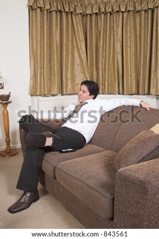 business man sitting on a sofa