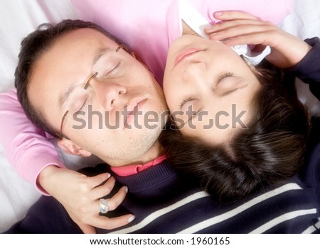 casual couple in love over white - soft focus