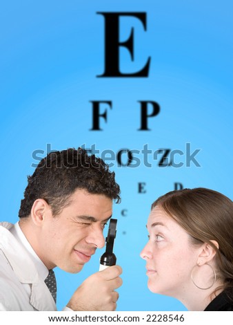 eye test - doctor and patient with the eye chart in the background