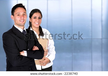 business partners in a corporate environment both smiling