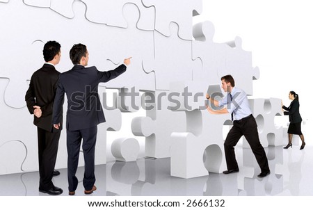 business teamwork business men making a puzzle over a white background business teamwork business men making a puzzle over a white background