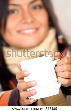 casual girl holding a white mug in warm orange clothes