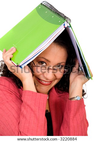 Woman covering herself with a notebook over a white background