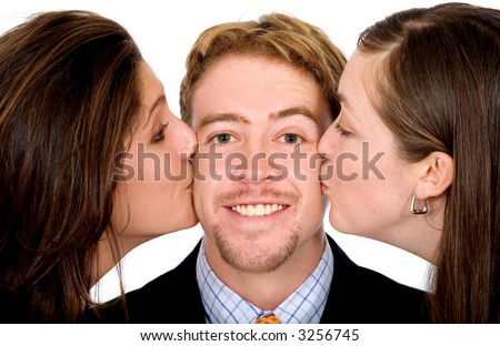 stock photo Business man with two girls kissing him at the same time 