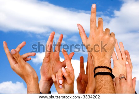 many hands wanting to participate in the voting - over a blue sky