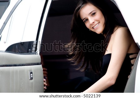 young girl coming out from a limousine