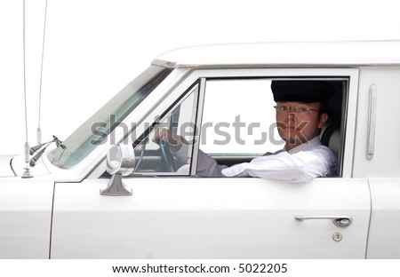 limousine driver inside the car over a blue sky
