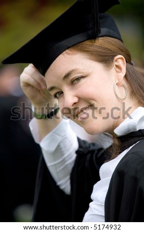 portrait of a happy female graduating at university