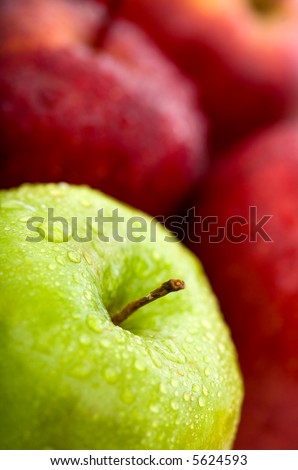 apples in green and red good for a background as the focus is on the green apple in the foreground