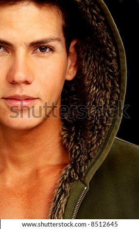 stock photo fashion male portrait with a hodded coat over a black 