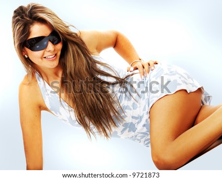 fashion or casual woman portrait wearing sunglasses giving a big smile