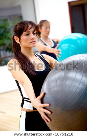 two people doing pilates at the gym
