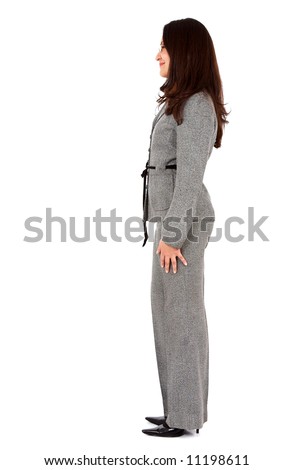 stock photo : business woman standing from the side isolated over a white 