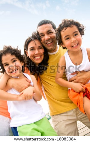 happy family portrait outdoors during a holiday - togetherness concept