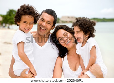 stock photo happy family portrait at the beach smiling
