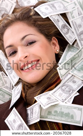 business woman millionaire with money around her face
