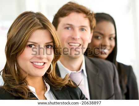 business team smiling in an office - diversity