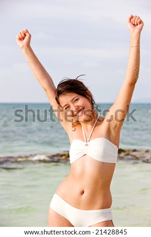 beach freedom woman with arms open having fun