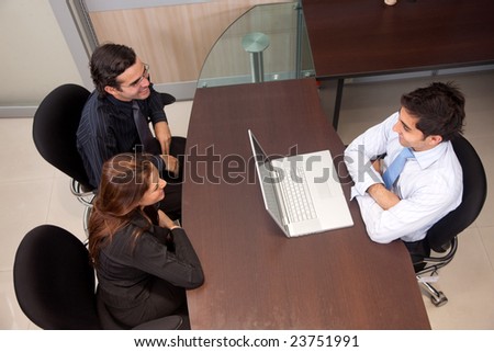 Business couple having an interview with a CEO in an office