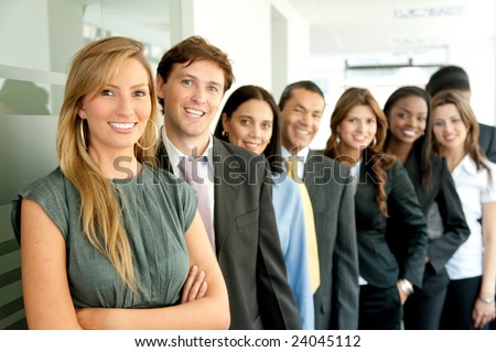 business people images. stock photo : group of business people smiling in an office lined up