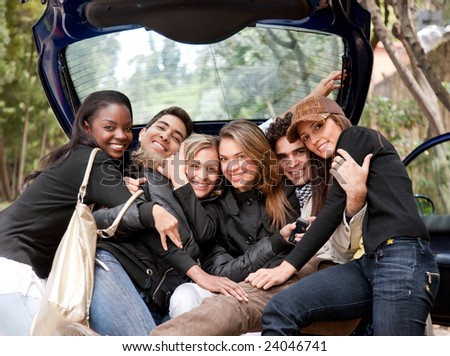 Group of friends together in the back of a car