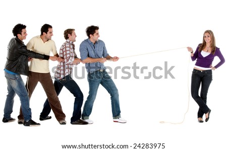 Beautiful woman pulling a rope against a male team -  isolated on white