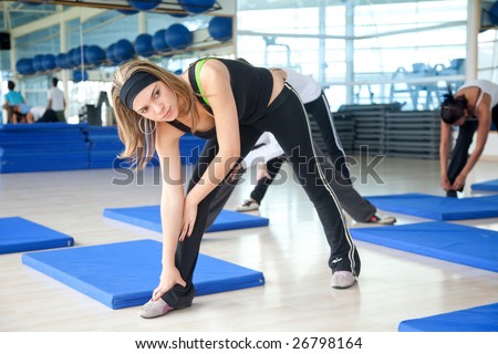 Woman in a stretching class at the gym