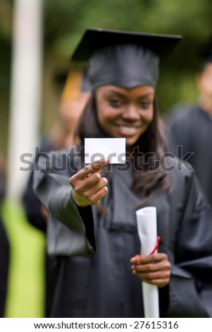 Graduate woman displaying a business card