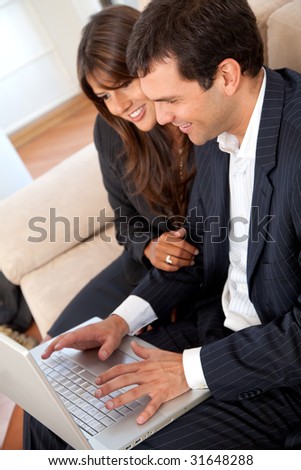 small business team in a meeting on a laptop computer in an office