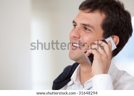 black businessman in an office on the phone