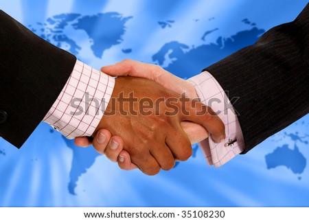 Business people handshaking with a world map at the background